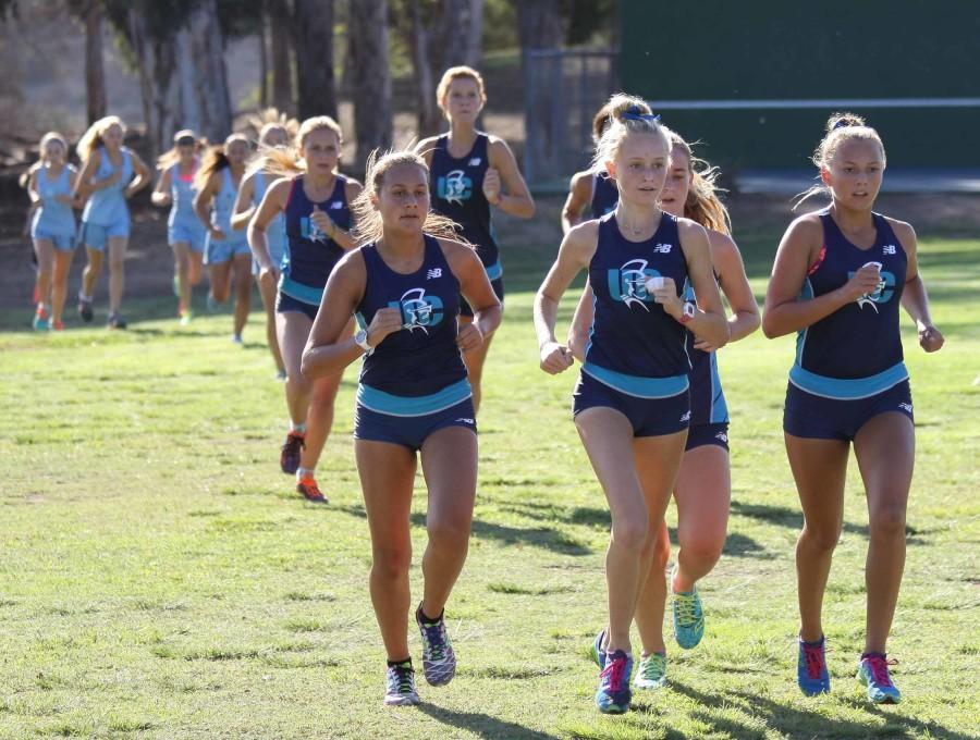 The UC High top seven varsity girls maintain a tight pack as the compete against OLP High.