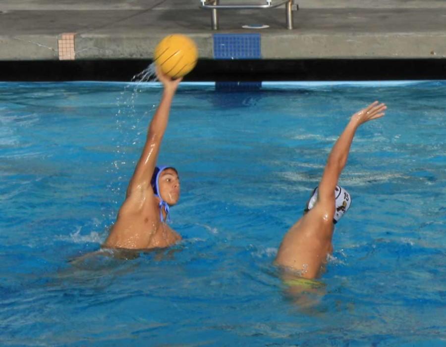 Senior Noah Graciani attempts to smash the ball past his opponent.