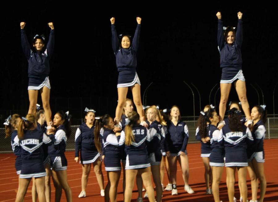 The UC High Cheer Team celebrates after a touchdown against Santana High.