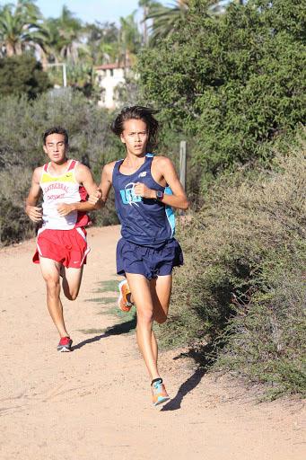 Senior David Berard runs past his opponent in a race. 