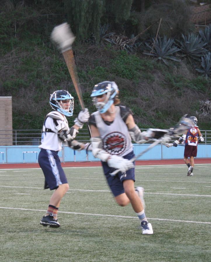 Junior Bryce Todd and Sophomore Ryan Reddish scrimmage at a recent practice to prepare for the upcoming season this spring.