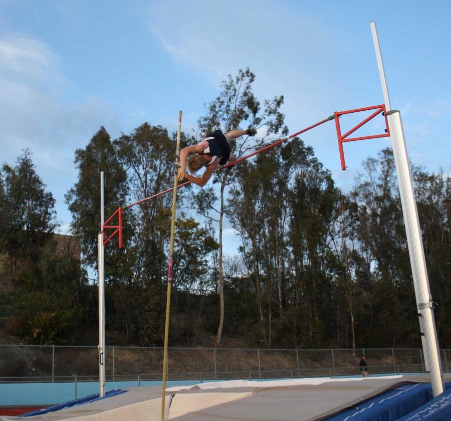 Senior Adam Timms practices pole vaulting to prepare for upcoming meets.
