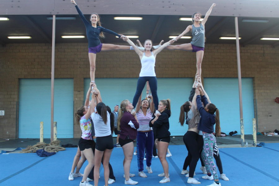 Sophomore Sophia Jimenez, Senior Morgan Johnson, Senior Ceci Vallejos, Senior Sophia Cook, Freshman Olivia Alfonso, Junior Julia Hagstrom, Junior Sugey Martinez, Senior Ashley Wilcox, Sophomore Alexis McKinney, and Freshman Charlisse Ringfield practice a stunt (top to bottom, left to right). 