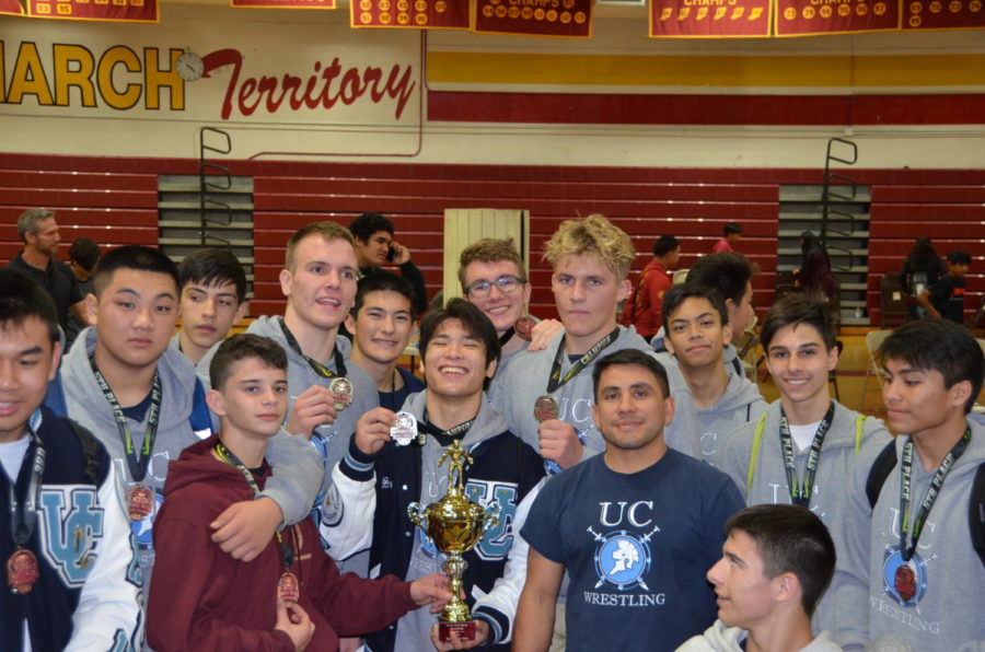 The UC High Wrestling Team celebrates their success after taking second in CIF team duels. 