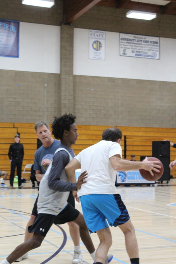 Senior Jaren Pallemon-Bell guards Principal Jeff Olivero.