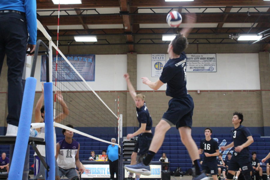 Senior Outside Hitter Connor Martin goes up for a kill on a set from Senior Setter James McMillan in a non-League match versus Carlsbad High.