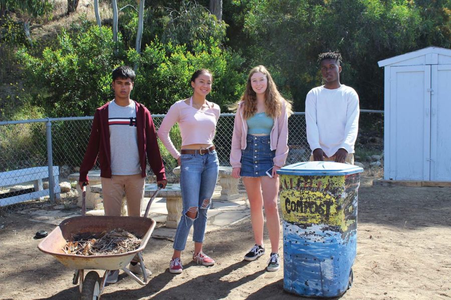 Sophomores Guarav Bharti, Alyssa Dunley, Hannah Griswold, and Mudia Mowoe work to remodel the school’s garden.