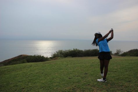 Freshman Tinotenda Feremenga follows through on her shot at Torrey Pines Golf Course.
