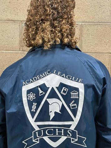 Senior Zachary Grover pictured with his Academic League Club jacket from a previous season.