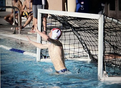 Senior Goalie Justin Silvia makes a save during an 12-10 win in a League game at Scripps Ranch.