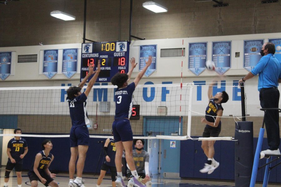 Junior Shahab Asgari and Senior Phillip Allen go up for a block at home against Morse.