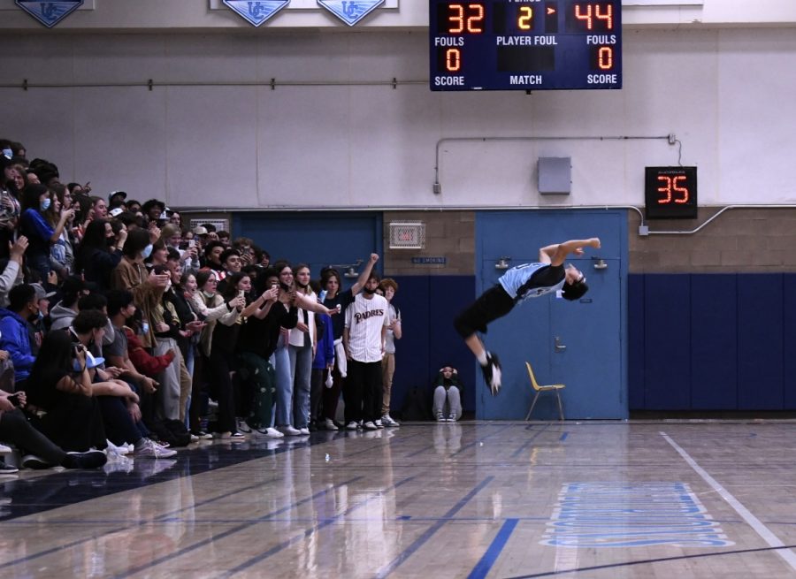 Nguyen performing his iconic backflip at the Seniors vs Staff Basketball game.