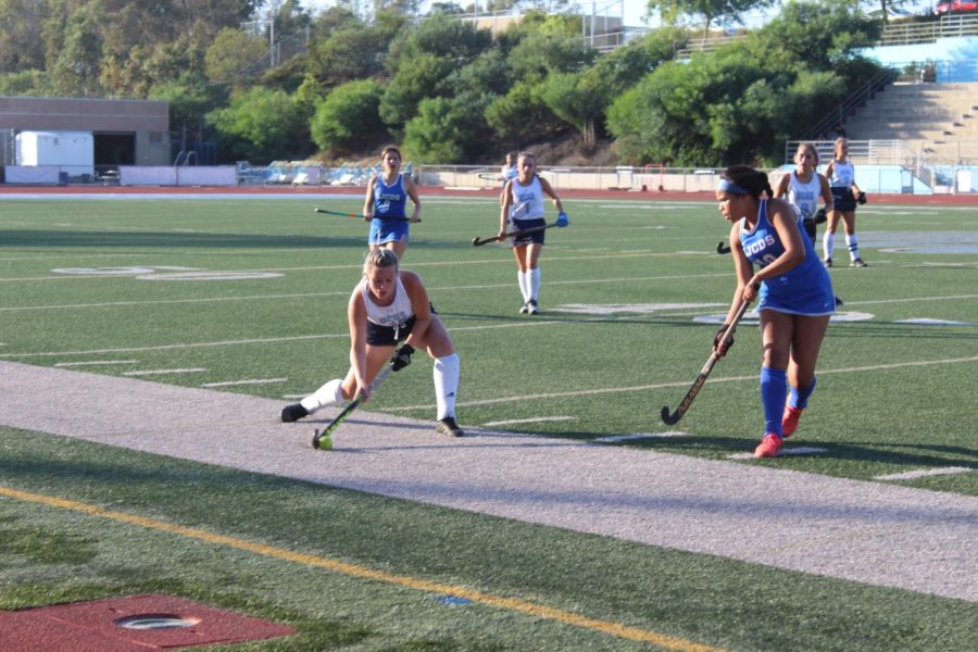 Junior Sydney Buchanan making a pass down the field at the team's first League game.