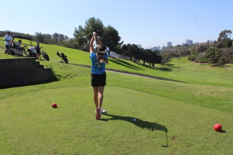 Junior Paula Danemann Soto practicing her swing at Balboa Park Golf Course. 
