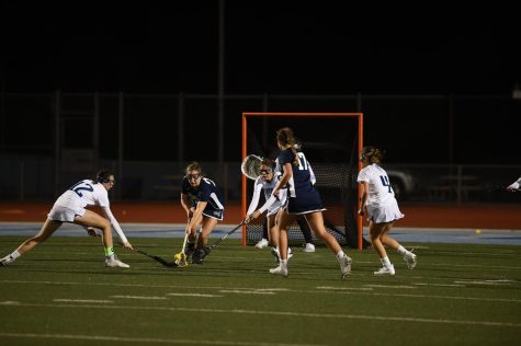 Junior Addison Stoppenhagen and Senior Julissa Vielma fighting for a ground ball at a game against San Dieguito Academy.