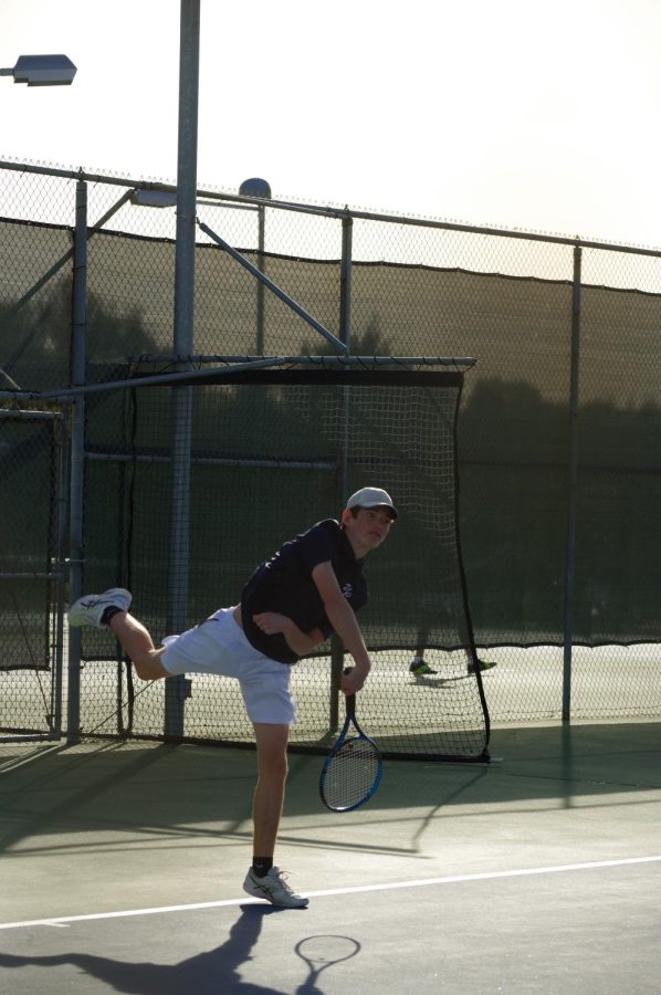 Junior Graeson Seminoff acing a serve against Saint Augustine High School.