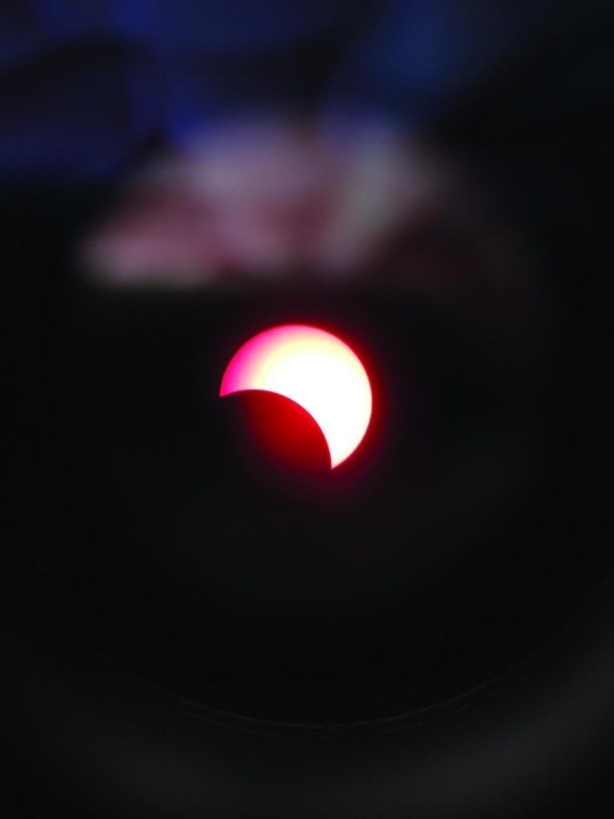 The Sun partially covered by the Moon as seen through Patterson’s solar telescope.