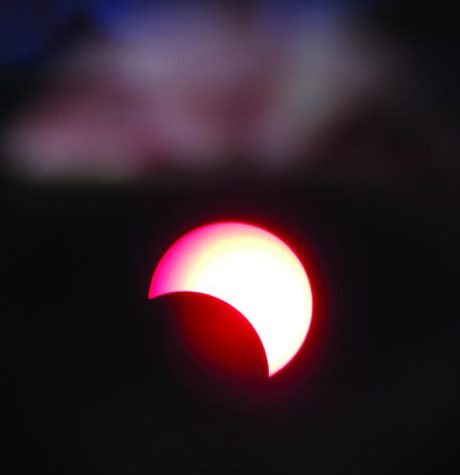 The Sun partially covered by the Moon as seen through Patterson’s solar telescope.
