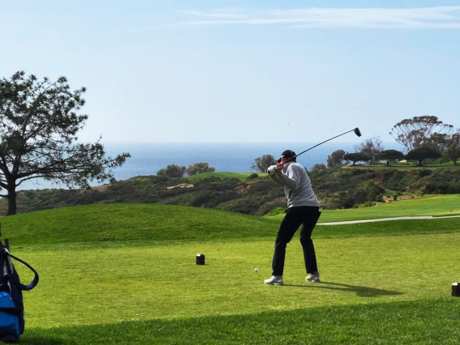 Senior Noah Bolton teeing off at Torrey Pines Golf Course at a match against Point Loma.