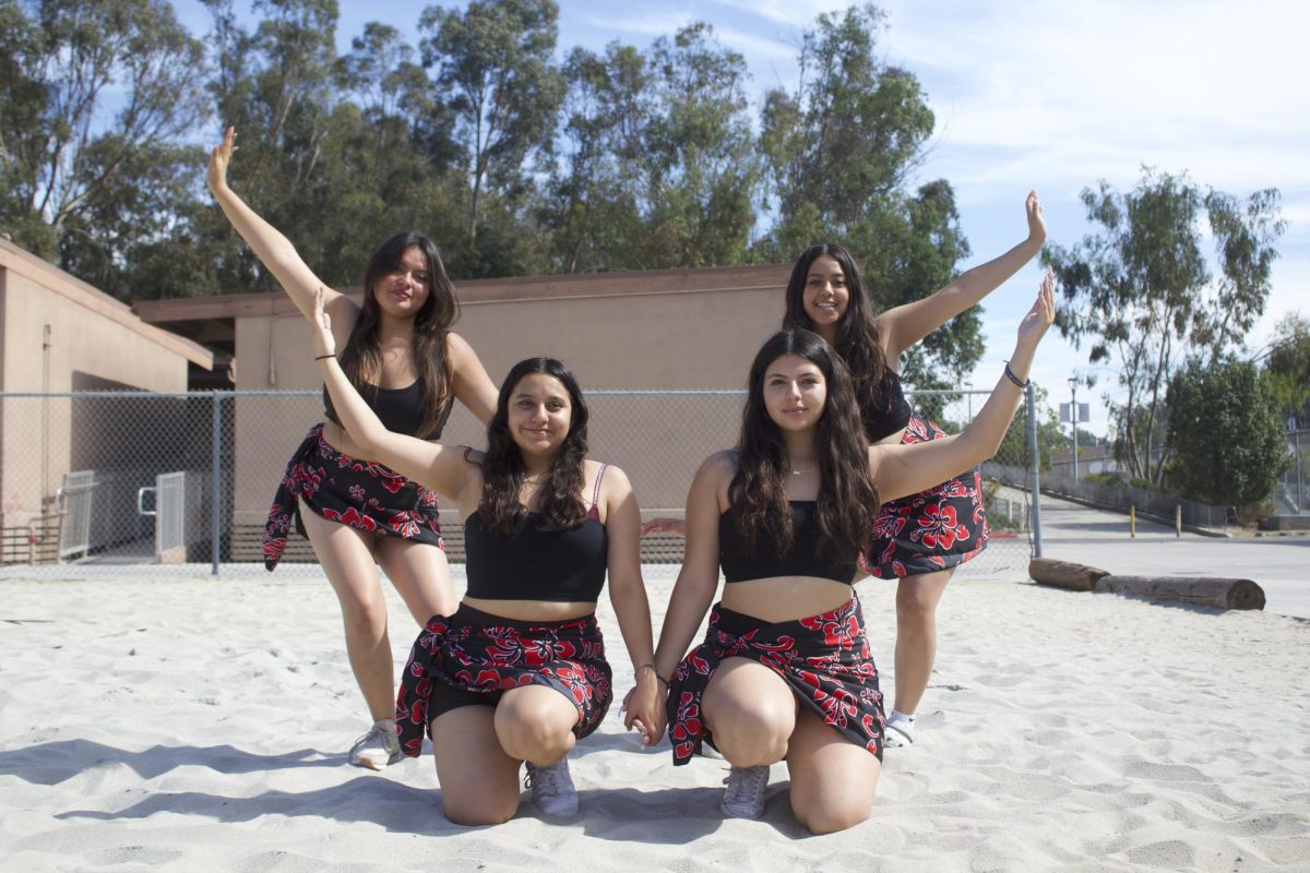 Senior Hannah González Hernández, Junior Guadalupe Suarez, Senior Stephanie Pulido, and Senior Valeria Serrano (left to right) pose on the beach volleyball court.