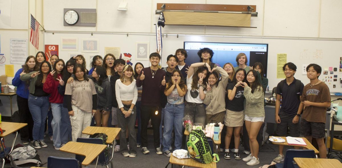 AVID, First Generation Scholars Clubs pose for a photo in Teacher Michele Fournier’s room.