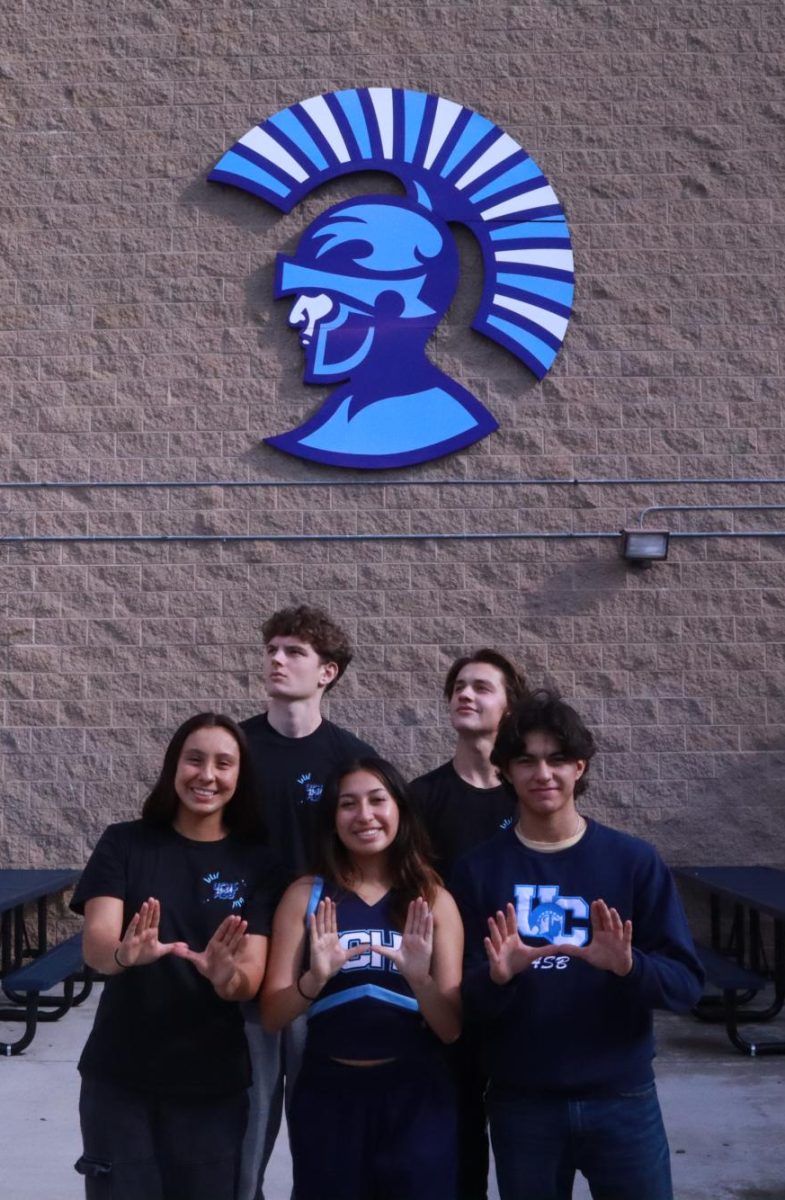 The Seniors of the Roman Legion Commission show spirit in front of the gymnasium.