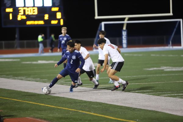 Senior Anthony Jimenez dribbles down the sideline in a game against
Hoover High on January 5.