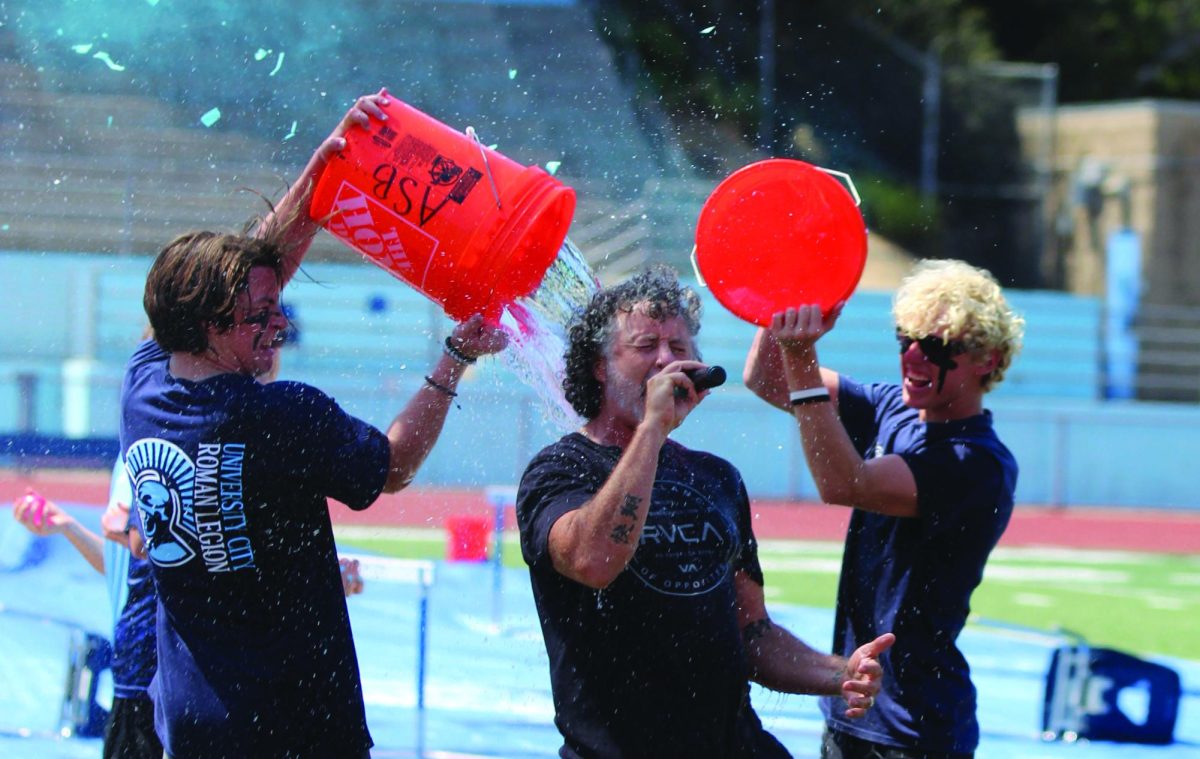 Teacher Matt Burke gets soaked at the first pep rally of the year.