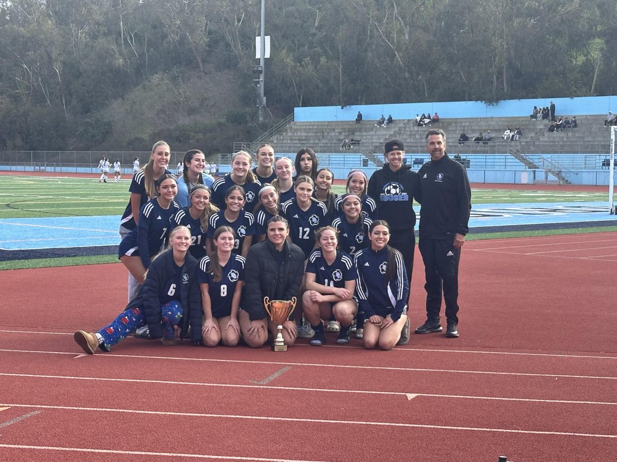 Coach Jason Donlon with the Soccer team after winning the UC High Jubilee.